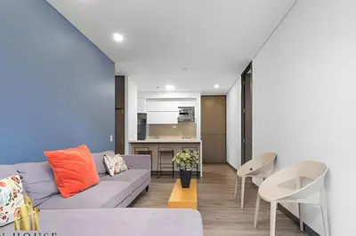 a living room with a couch and a table and chairs at Class Suites 202 - Colorful with Pool and gym in El Poblado