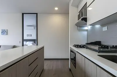 a kitchen with a sink and a counter top at Class Suites 503 - Bright & Minimalistic Apt/Pool in El Poblado