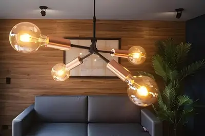 aendant light hanging over a couch in a living room at Condado 204 - Eco Apt/Natural Atmosphere in El Poblado