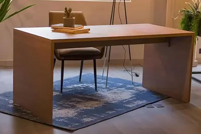 a wooden desk with a chair on a rug at Condado 204 - Eco Apt/Natural Atmosphere in El Poblado