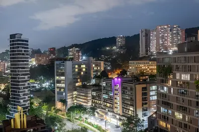 a city skyline with tall buildings at night at Energy 1603 - Modern Design & Prime Location/ AC in El Poblado
