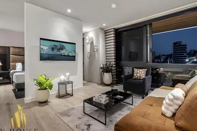a living room with a couch and a table at Energy 1603 - Modern Design & Prime Location/ AC in El Poblado