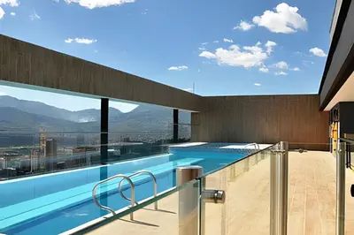 a swimming pool with a view of the mountains at Energy 403 - Prestigious Urban Oasis / Pool in El Poblado