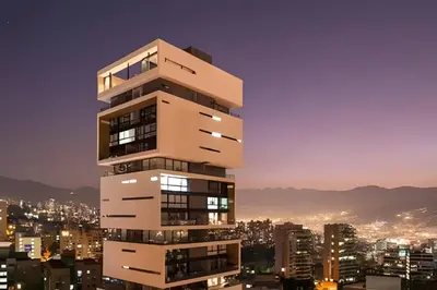 a tall building with a city in the background at Energy 403 - Prestigious Urban Oasis / Pool in El Poblado