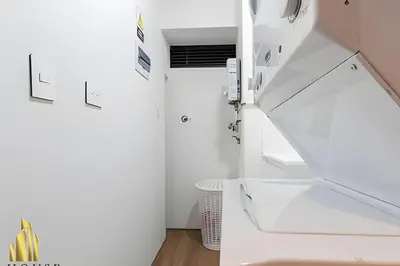 a staircase in a white room with a white sink at Energy 601 - Prestigious Apt/Pool & Jacuzzi in El Poblado