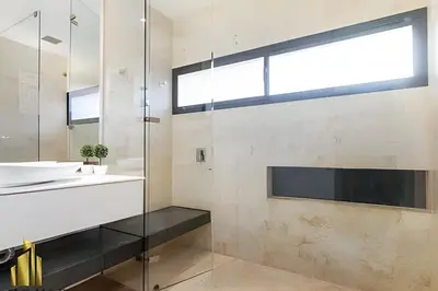 a bathroom with a sink and a mirror at Energy 601 - Prestigious Apt/Pool & Jacuzzi in El Poblado