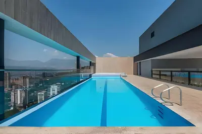 a swimming pool on the roof of a building at Energy 601 - Prestigious Apt/Pool & Jacuzzi in El Poblado