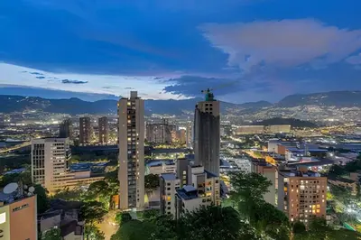 a city skyline at night with tall buildings at Finito 1512 - Modern Apt with Views & Balcony in El Poblado
