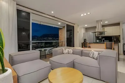 a living room with a couch and a table at Finito 1512 - Modern Apt with Views & Balcony in El Poblado
