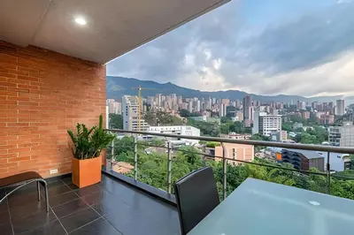 a balcony with a view of a city at Gauss 1205-Serenity Modern Apt/Terrace/Squash/Gym in El Poblado