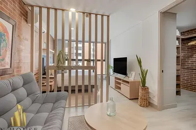 a living room with a couch and a table at Kyux 405 - The Icon of Exclusivity in Laureles in Alpujarra