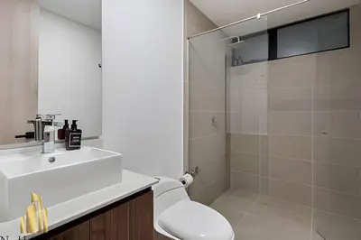 a bathroom with a toilet and a sink and a shower at Kyux 408 - The hidden gem of Laureles in Alpujarra