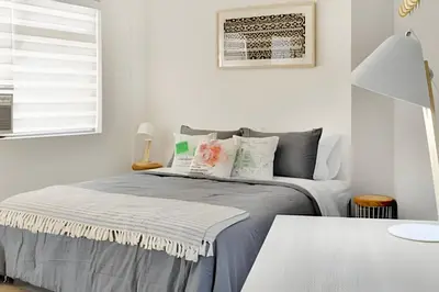 a bedroom with a bed and a window at La 70 Laureles 302 - Fresh & Well Apt/Priv balcony in Guayaquil