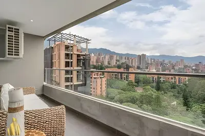a balcony with a view of a city at Life 1202 - Pleasant Apt in Poblado with AC in El Poblado
