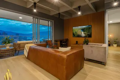 a large room with a bed and a large window at Life 1603 - Panoramic & Tastefully Decorated Loft in El Poblado