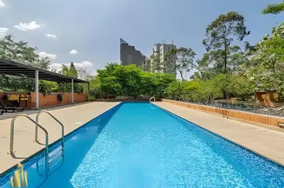 a large swimming pool with blue water at Life 1603 - Panoramic & Tastefully Decorated Loft in El Poblado