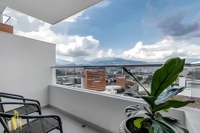 a balcony with a view of a city at Metropolitan 2226-Familiar Bright Apt/Priv balcony in El Salvador
