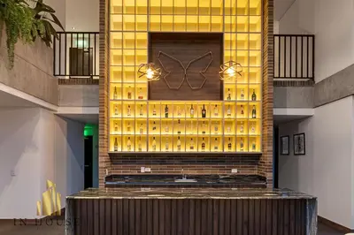 a tasting room with a wall of wine bottles at Morph 1001 - Exclusive apt in Poblado/BBQ in El Poblado