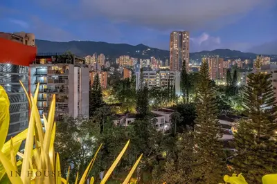 a city skyline at night with tall buildings at Morph 1001 - Exclusive apt in Poblado/BBQ in El Poblado