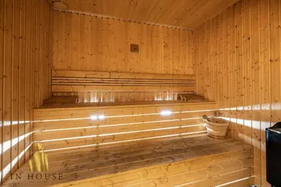 a sauna with wooden walls and a wooden tub at Morph 1002 - Luxe apt in Poblado/AC/BBQ in El Poblado