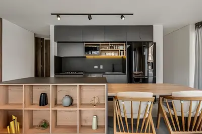 a kitchen with a wooden table and chairs at Morph 1101 - Sophisticated & brigh apt/ BBQ in El Poblado