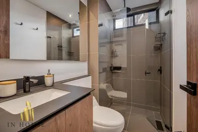 a bathroom with a toilet and a sink and a shower at Morph 1201 - Elegant/Modern Apt in Poblado in El Poblado