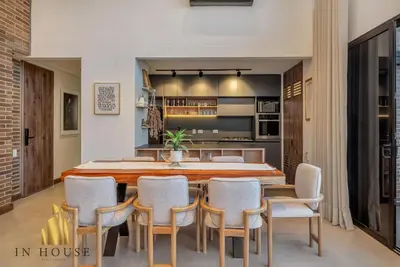 a dining room with a large wooden table and chairs at Morph 1201 - Elegant/Modern Apt in Poblado in El Poblado