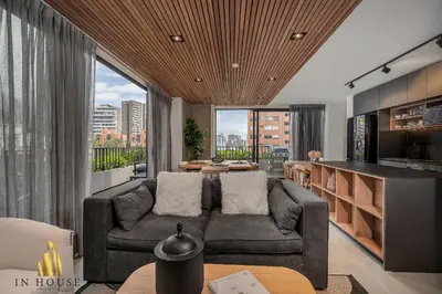 a living room with a couch and a table at Morph 1202 - Stylish City Living: Modern Apt in El Poblado