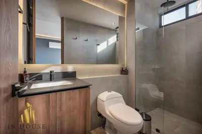 a bathroom with a toilet and a sink and a shower at Morph 1301 - Chill Haven BBQ, Jacuzzi, AC in El Poblado