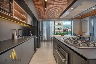a kitchen with a stove and a counter top at Morph 1301 - Chill Haven BBQ, Jacuzzi, AC in El Poblado