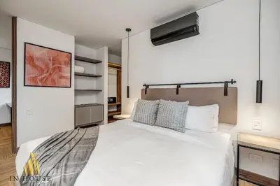 a bedroom with a large white bed in a room at Morph 1302 - Spacious & private apt w BBQ/Jacuzzi in El Poblado