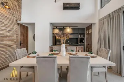 a dining room with a table and chairs at Morph 1401 - Luxe & bright ap in Poblado with AC in El Poblado