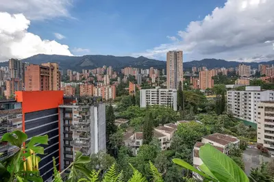 a view of a city with buildings and trees at Morph 1401 - Luxe & bright ap in Poblado with AC in El Poblado