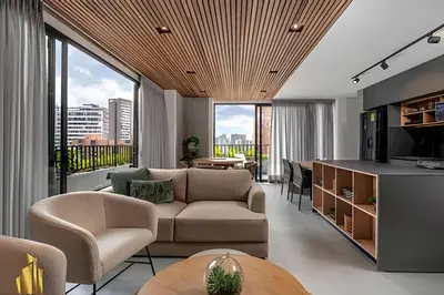 a living room with a couch and a table at Morph 1402 - Stylish apt in Poblado/AC/Jacuzzi in El Poblado
