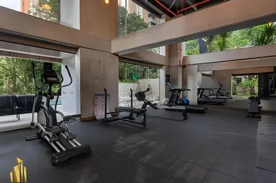 a gym with treadmills and ellipticals in a building at Morph 1402 - Stylish apt in Poblado/AC/Jacuzzi in El Poblado