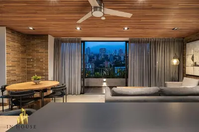 a living room with a couch and a table at Morph 1501 - Vibrant apt in Poblado/AC/Jacuzzi/BBQ in El Poblado