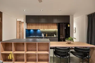 a kitchen with a wooden counter top and black chairs at Morph 1501 - Vibrant apt in Poblado/AC/Jacuzzi/BBQ in El Poblado