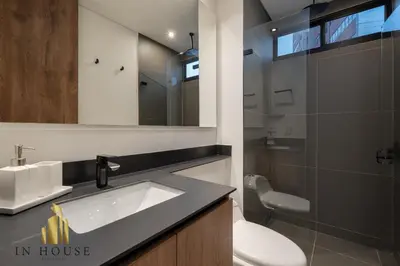 a bathroom with a sink and a toilet and a mirror at Morph 1601 - Exclusivity in Poblado/Jacuzzi in El Poblado