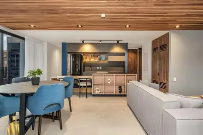 a living room and kitchen with a table and a couch at Morph 1602 - Luxury escape in Poblado/Jacuzzi/AC in El Poblado