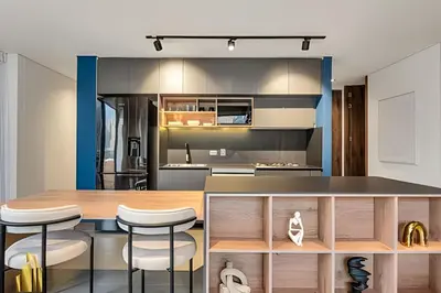 a kitchen and dining room with a table and stools at Morph 1602 - Luxury escape in Poblado/Jacuzzi/AC in El Poblado