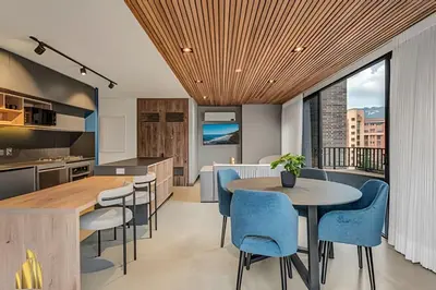 a kitchen and dining room with a table and chairs at Morph 1602 - Luxury escape in Poblado/Jacuzzi/AC in El Poblado