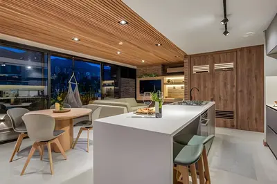 a kitchen with a white island and a dining room at Morph 1901 - Cozy Space with priv Balcony/BBQ in El Poblado