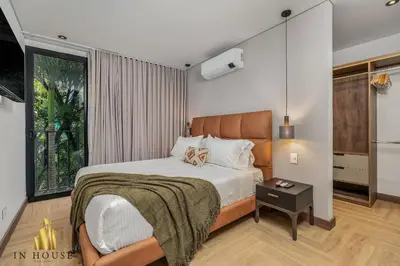 a bedroom with a bed and a window at Morph 301 - Fresh Air Retreat in Poblado/AC in El Poblado