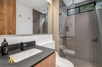a bathroom with a sink and a shower at Morph 401 - Modern apt High Ceilings BBQ/Jacuzzi in El Poblado