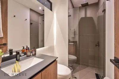 a bathroom with a sink and a toilet at Morph 402 - Serene Getaway: Jacuzzi, AC, BBQ in El Poblado