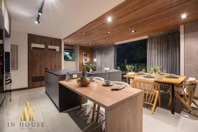 a kitchen and living room with a table and chairs at Morph 402 - Serene Getaway: Jacuzzi, AC, BBQ in El Poblado