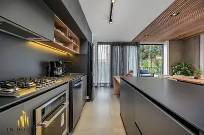 a kitchen with stainless steel appliances and a counter at Morph 501 - Spacious Cozy Apt Poblado/BBQ/Jacuzzi in El Poblado