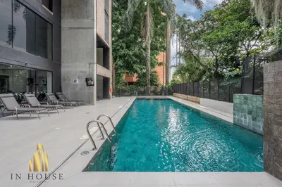 a swimming pool in the middle of a building at Morph 502 - Bright & Spacious, Poblado/BBQ/Jacuzzi in El Poblado