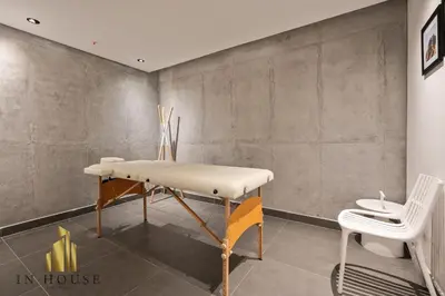 a table and chair in a room with a wall at Morph 502 - Bright & Spacious, Poblado/BBQ/Jacuzzi in El Poblado
