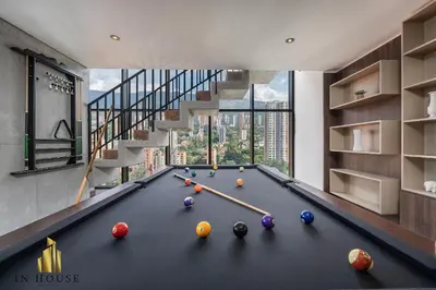 a pool table with balls on it in a house at Morph 601 - Elegance & tranquility with AC/BBQ in El Poblado